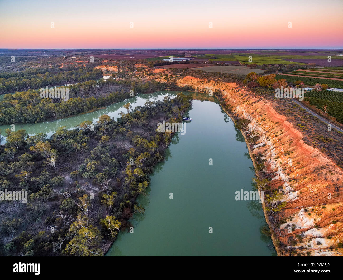 Aerial landscape of eroding sandstone shore of Murray RIver at sunset Stock Photo