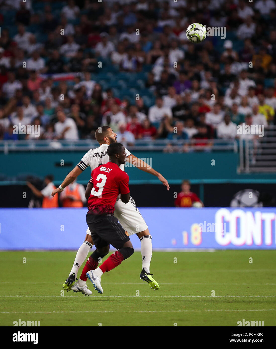 Miami Gardens, Florida, USA. 31st July, 2018. Real Madrid C.F. forward Karim Mostafa Benzema (9) and Manchester United F.C. defender Eric Bailly (3) anticipate a header during an International Champions Cup match between Real Madrid C.F. and Manchester United F.C. at the Hard Rock Stadium in Miami Gardens, Florida. Manchester United F.C. won the game 2-1. Credit: Mario Houben/ZUMA Wire/Alamy Live News Stock Photo