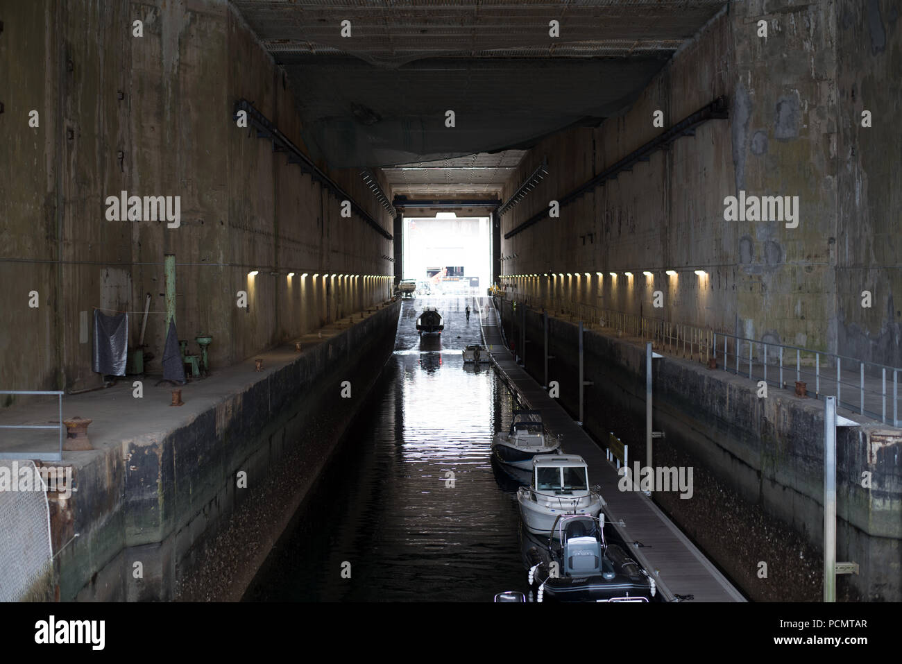 19.07.2018, France, Brittany, Lorient: A dock in the former German submarine bunker Keroman 1. The submarine bunkers in Lorient were built during the Second World War on behalf of the Wehrmacht under the direction of the organization Todt (OT). Photo: Ralf Hirschberger / dpa | usage worldwide Stock Photo