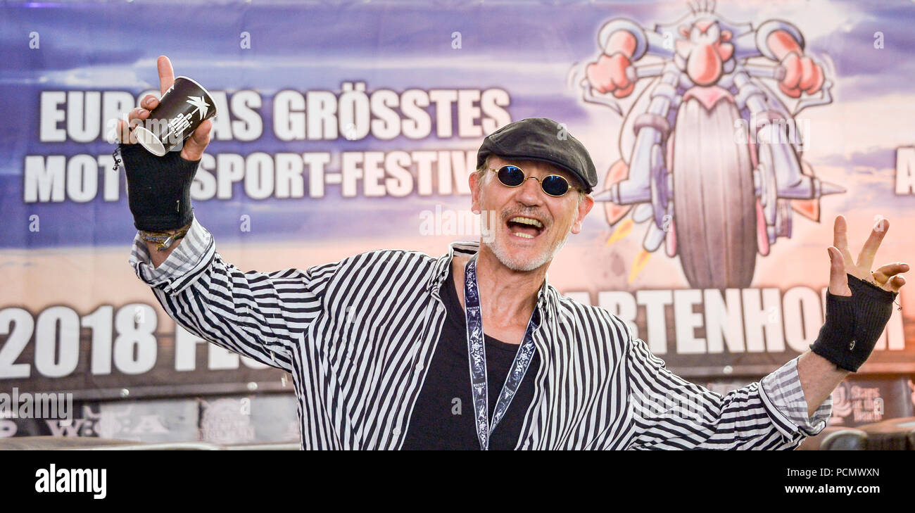 Wacken, Germany. 03rd Aug, 2018. Roetger Feldmann alias 'Broesel', cartoonist clowning around during the Wacken Open Air at a press conference on the 'Werner Race'. The new edition of the race between Feldmann and the innkeeper Henze will take place at a festival from 30 August to 2 September 2018 in Hartenholm in Schleswig-Holstein. Credit: Daniel Reinhardt, Axel Heimken/dpa/Alamy Live News Stock Photo