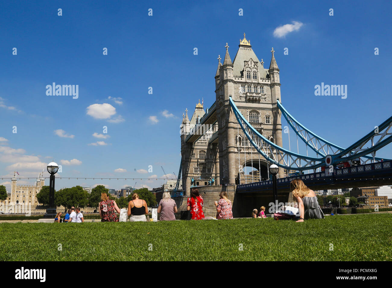 Potters Fields Park. London. UK 3 Aug 2018 - City workers enjoy the sunshine in Potters Fields Park with a view of Tower Bridge on another very hot day in the capital. According to the Met Office the heatwave is to continues in the UK and parts of Europe in coming days with record temperatures expected.  Credit: Dinendra Haria/Alamy Live News Stock Photo
