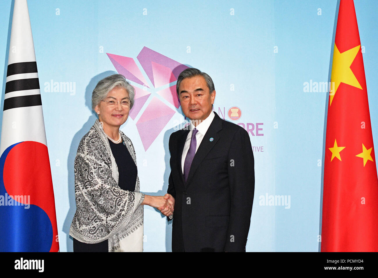 Singapore. 3rd Aug, 2018. Chinese State Councilor and Foreign Minister Wang Yi (R) meets with South Korean Foreign Minister Kang Kyung-wha in Singapore, Aug. 3, 2018. Credit: Then Chih Wey/Xinhua/Alamy Live News Stock Photo