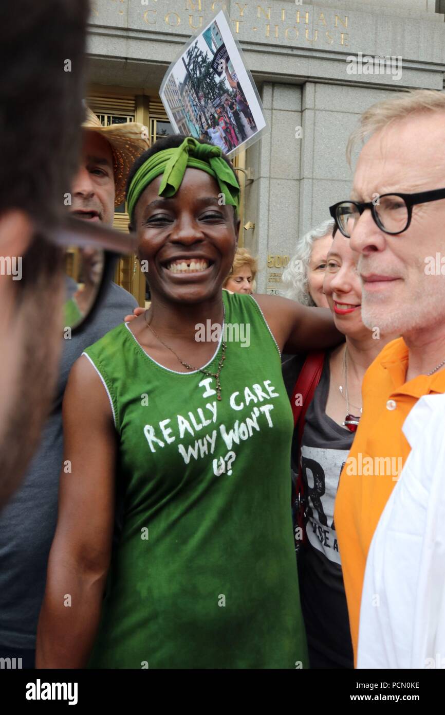 New York, NY USA. O3 Aug, 2018. Therese Patricia Okoumou, 44 (C), the woman who was arrested on 4th. July, 2018,  after she climbed onto the base of the Statue of Liberty to protest the Trump administration’s immigration policies, after she made a procedural court appearance in New York City on 3 Aug, 2018. The ‘Rise and Resist’ activist was  ordered to reappear in court on 1st. October, 2018. © 2018 G. Ronald Lopez/DigiPixsAgain.us/Alamy Live News Stock Photo