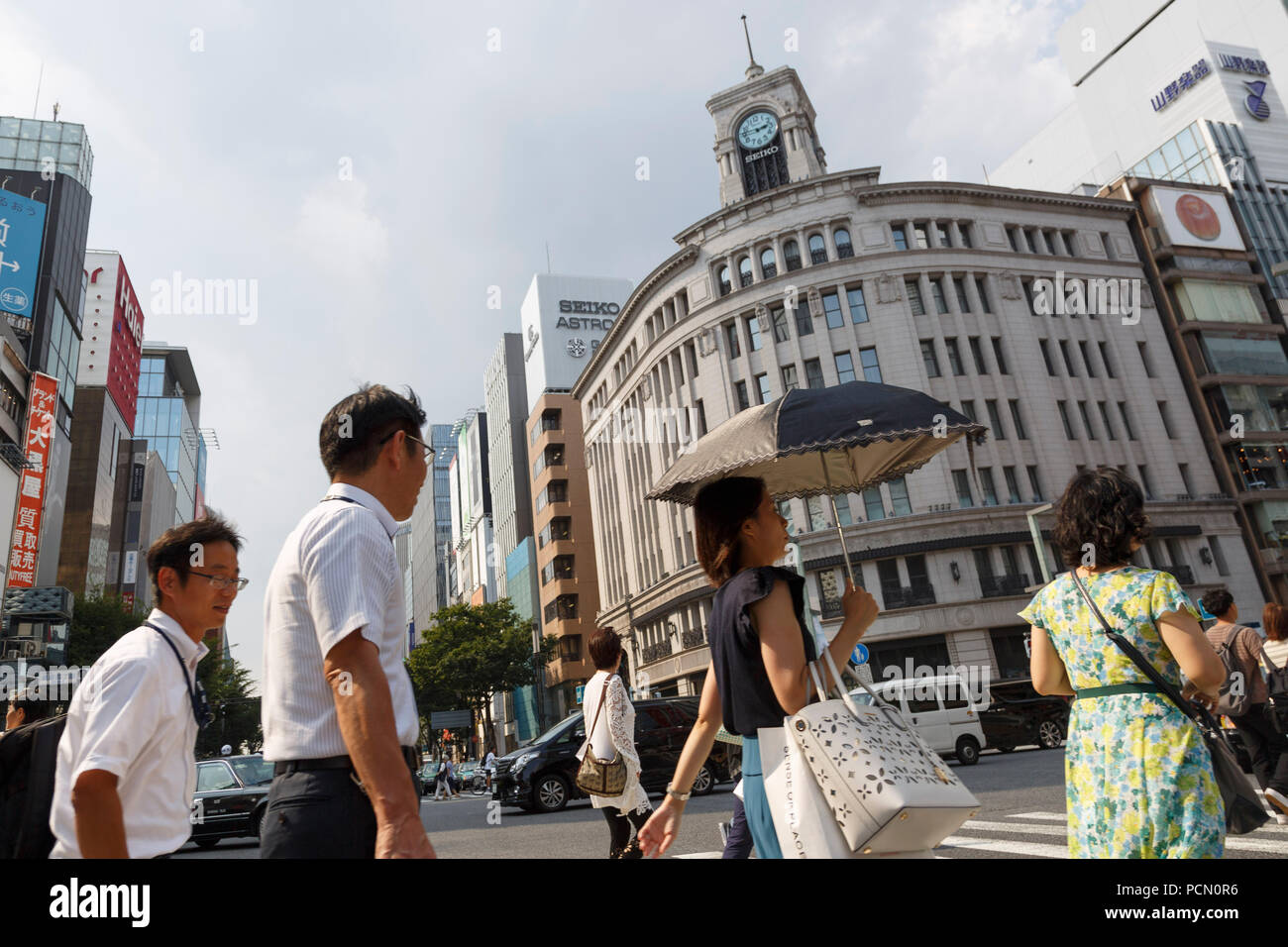 Pedestrians shade themselves with parasols in the heat in Ginza shopping district on August 3, 2018, in Tokyo, Japan. Temperatures topped 37 degrees Celsius in Tokyo, on Friday at 2 pm. According to the Tokyo Medical Examiner's Office, ninety-six people died of heatstroke in central Tokyo's 23 wards during the month of July, nearly four times as many as in the same period in 2017. Credit: Rodrigo Reyes Marin/AFLO/Alamy Live News Stock Photo