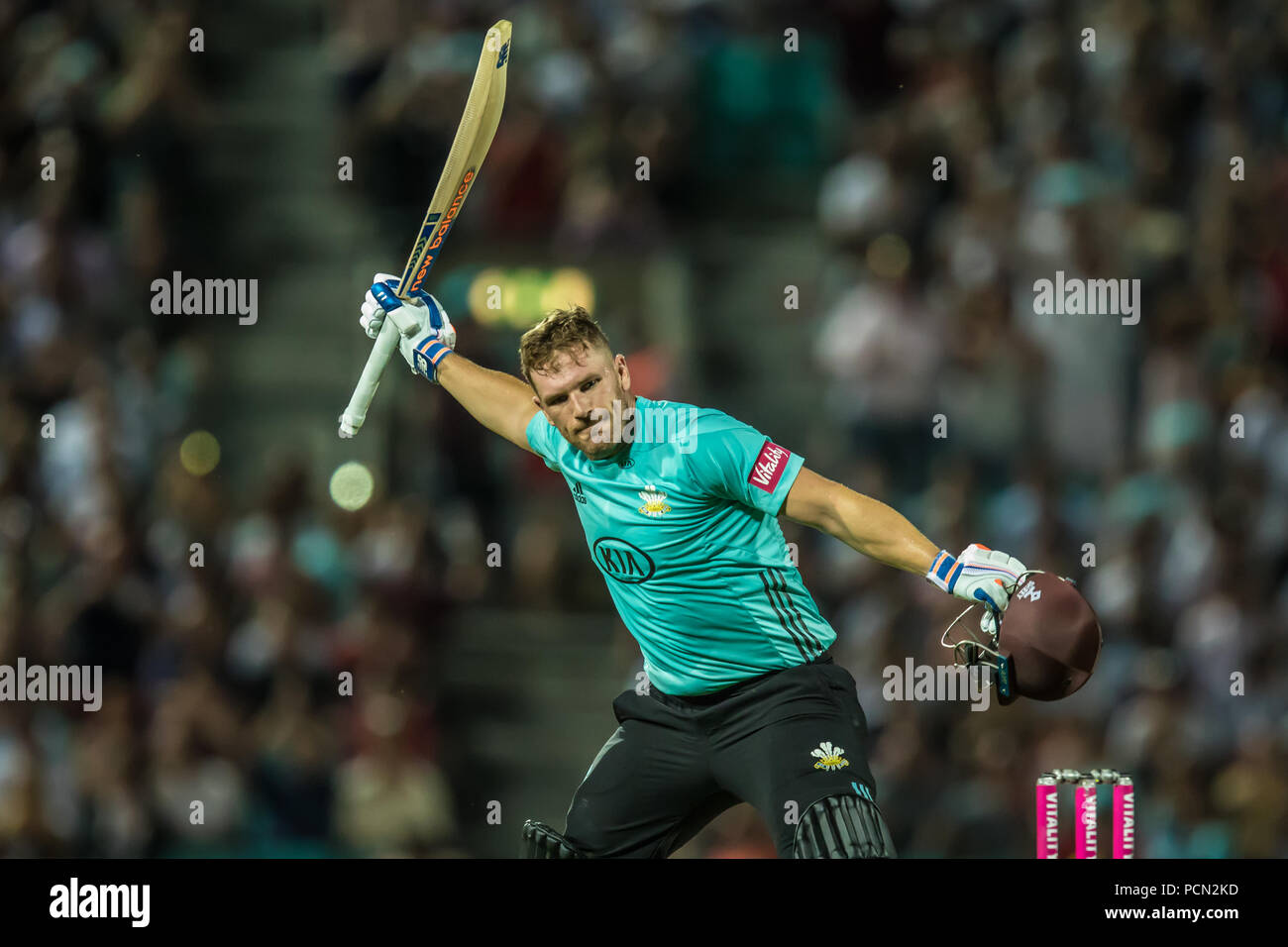 London, UK. 3 August, 2018. Aaron Finch celebrates after reaching his100 batting for Surrey against  Middlesex in the Vitality T20 Blast match at the Kia Oval. David Rowe/Alamy Live News Stock Photo