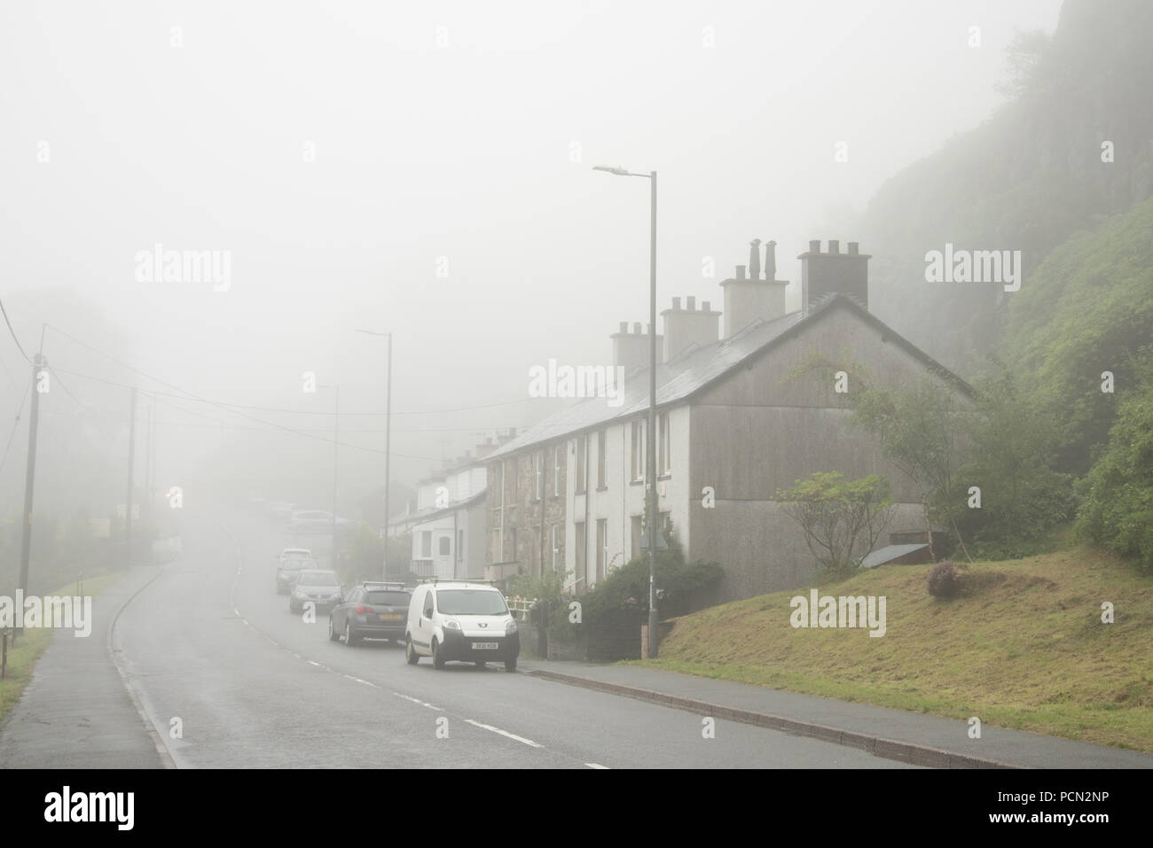 Blaenau Ffestiniog, Wales UK. 3rd August 2018. Despite much of the UK experiencing hot dry weather on 3rd August, Blaenau Ffestiniog, the town that once supplied the world with slate was shrouded in fog for much of the day. Credit: Richard Franklin/Alamy Live News Stock Photo