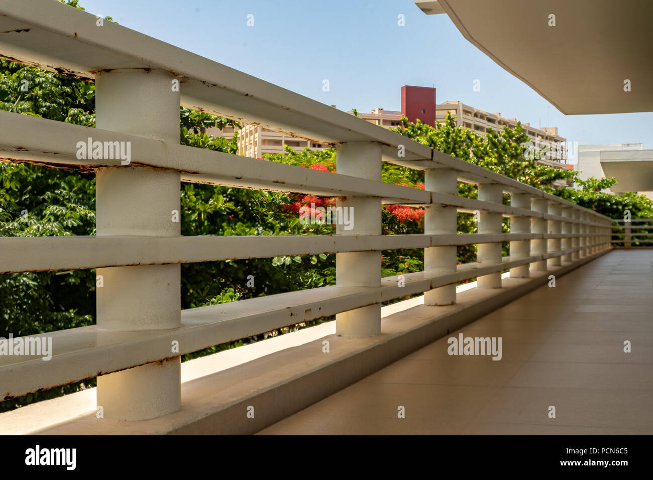 Cancun, Mexico; JUL 15 2018: metal white railing with some rusty sports ...