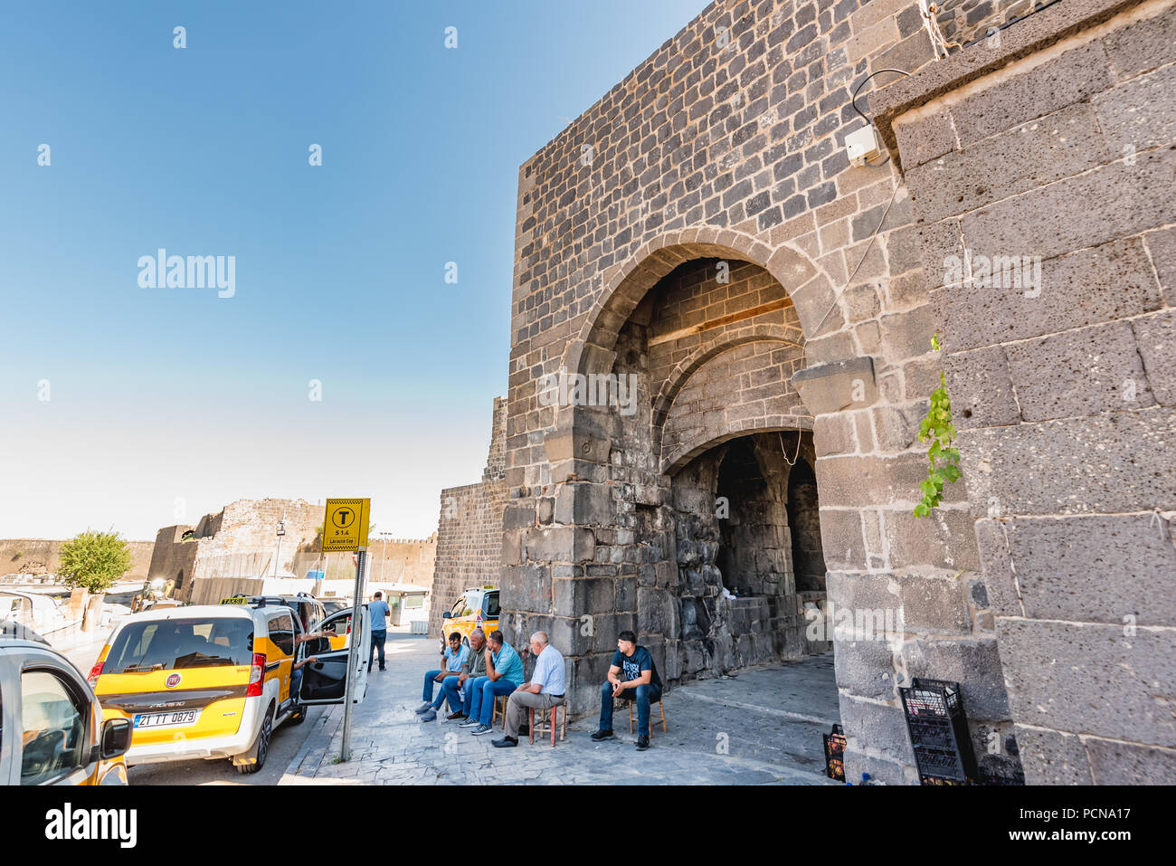 Unidentified people walk around historical gate named as Mardin gate in ...