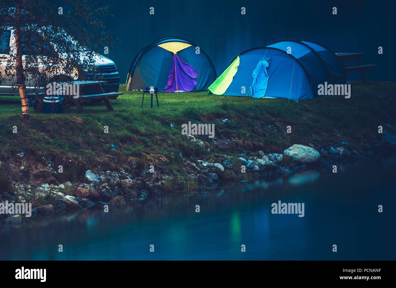 Waterfront Tent Camping Spot. Norwegian Nights. Scandinavian Travel Theme. Stock Photo