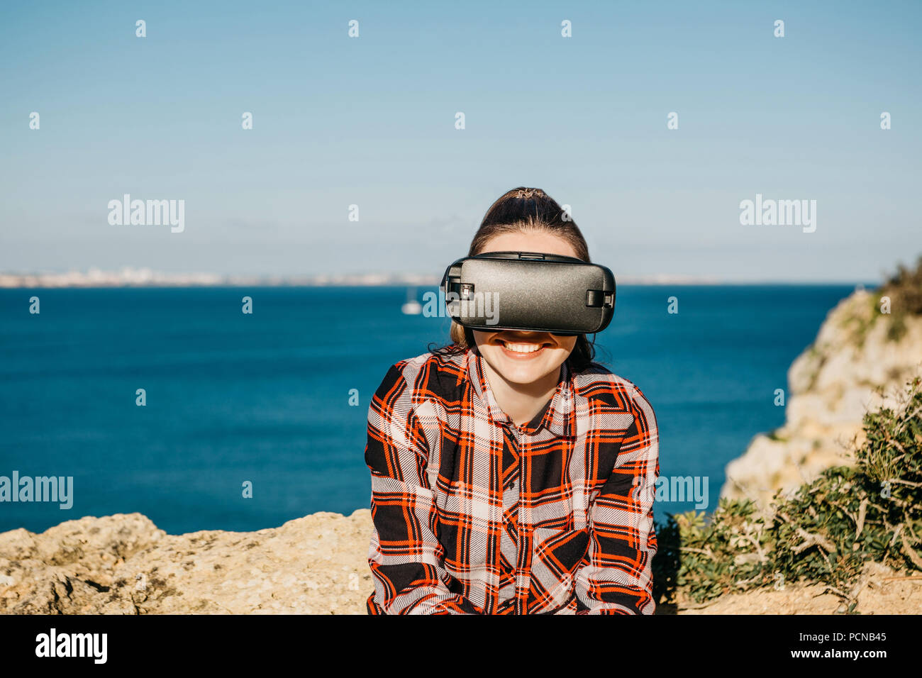 The girl in glasses of a virtual reality. Modern technology in everyday ...