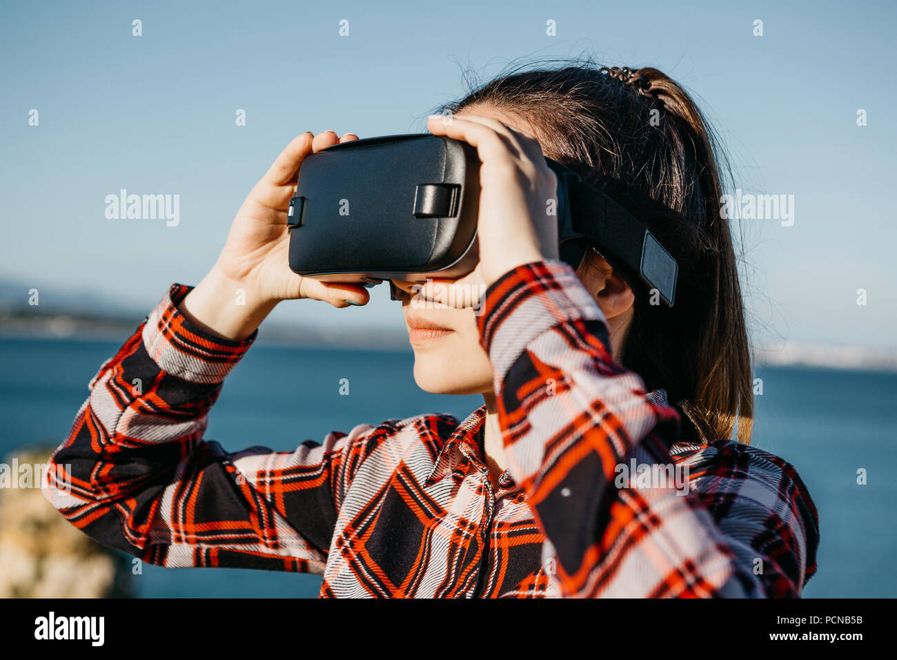 The girl in glasses of a virtual reality. Modern technology in everyday