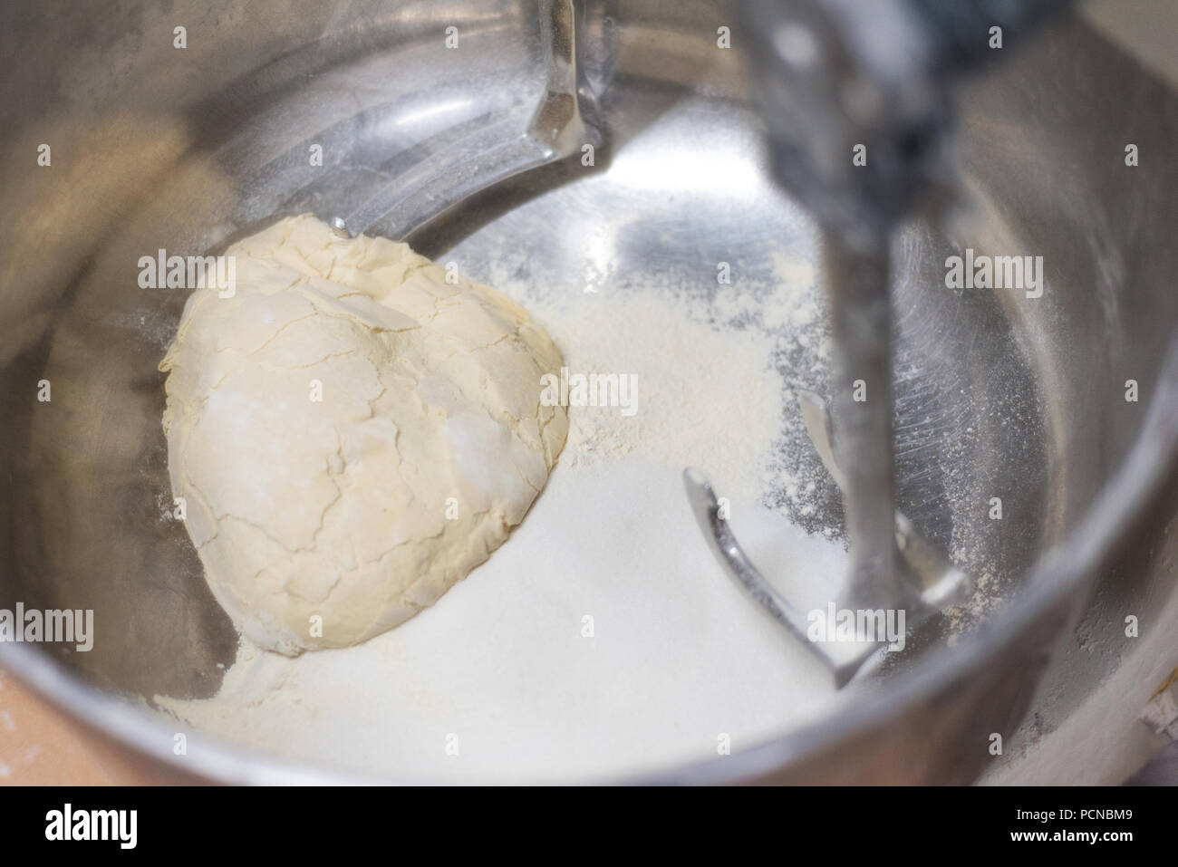 Close up view of mixer in Bakery, mixing dough for pastry in a bakery