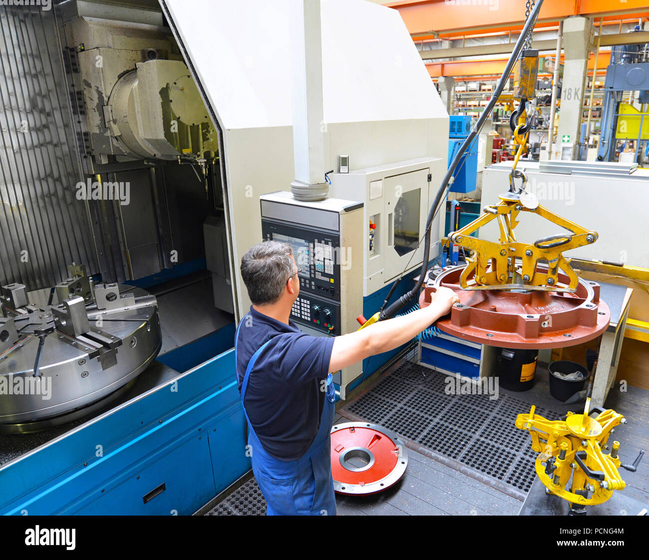 large modern cnc machine for the production of shafts for industrial  electric motors in the company Stock Photo - Alamy