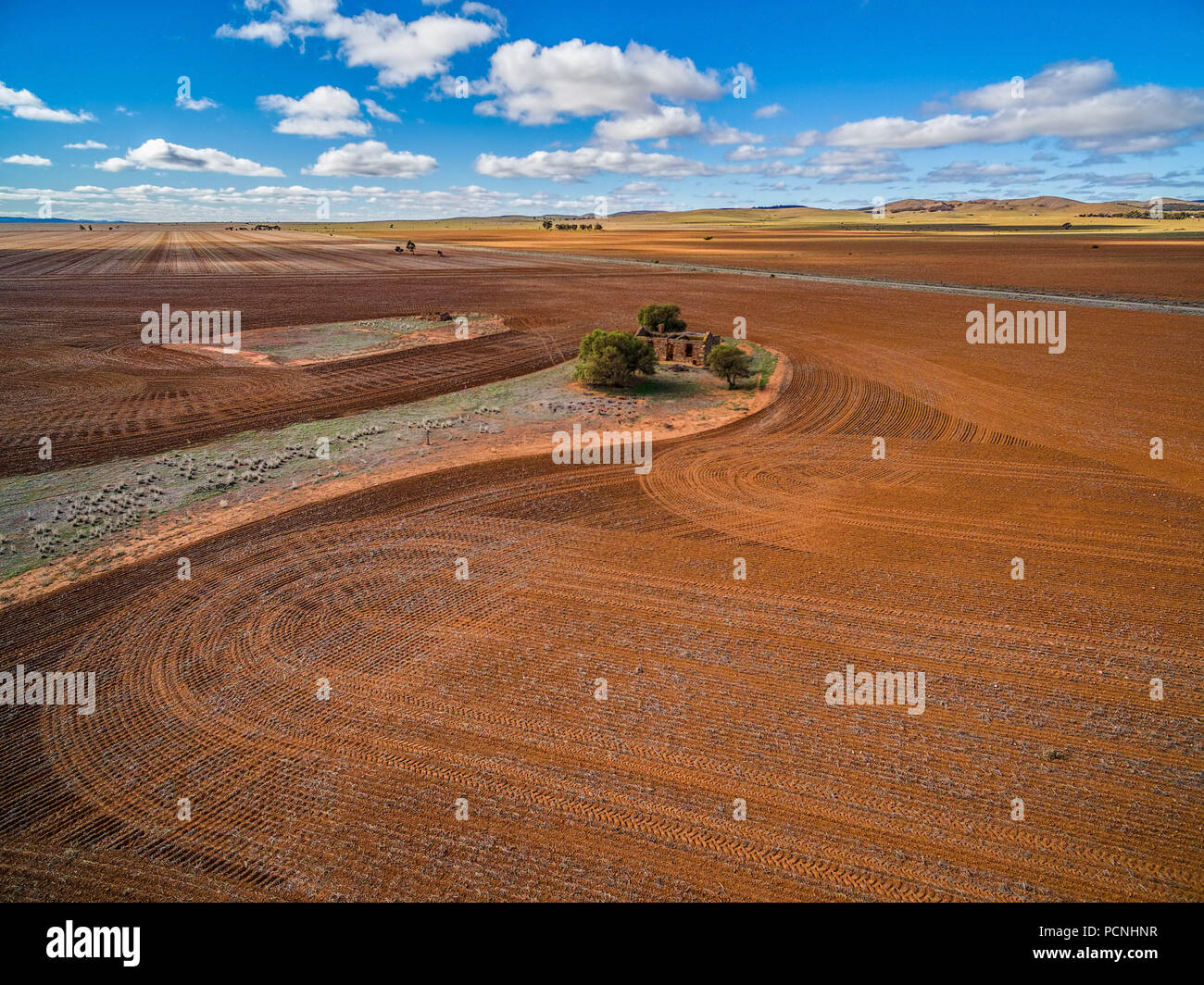 Plowed orange agricultural fields and old building ruins in South Australia Stock Photo