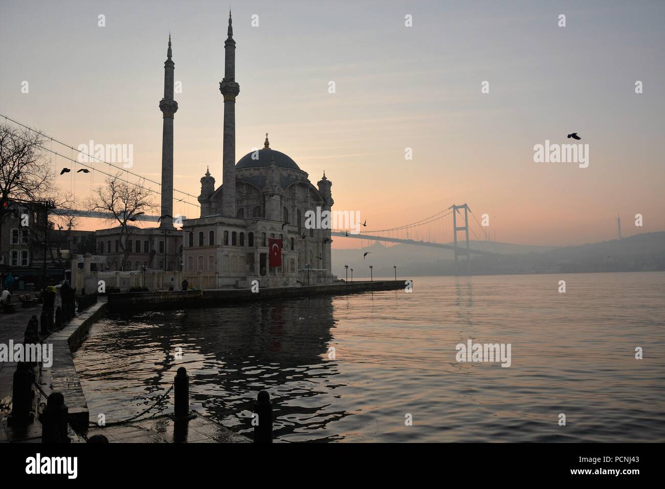 Sunrise in Istanbul, Ortaköy Mosque and the Bosphorus Bridge in the background Stock Photo