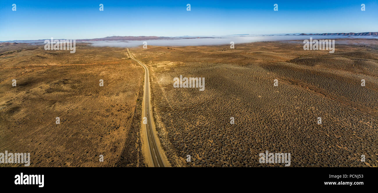 Rural highway passing through Australian outback desert leading to ...