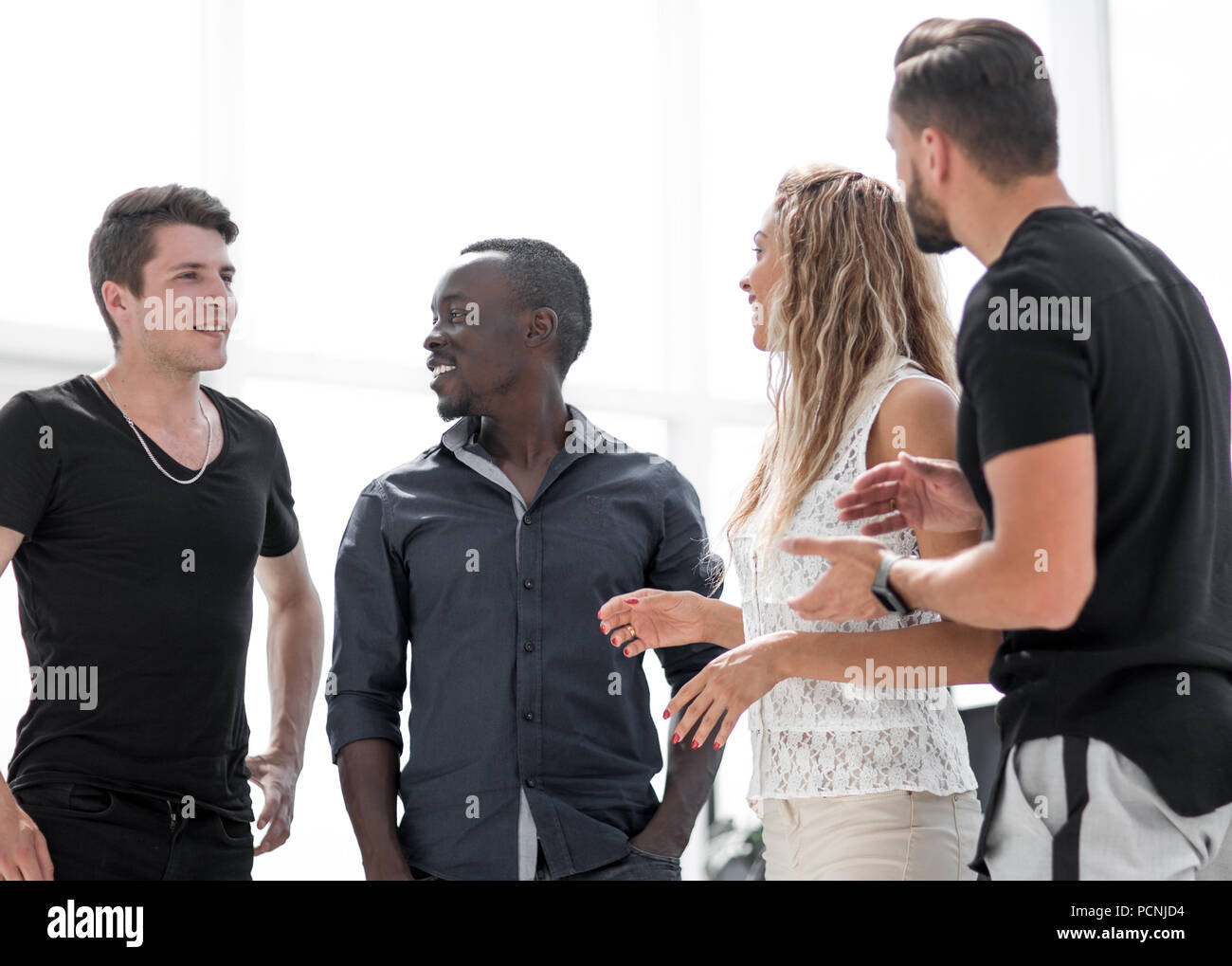 group of young people standing in the business center Stock Photo - Alamy
