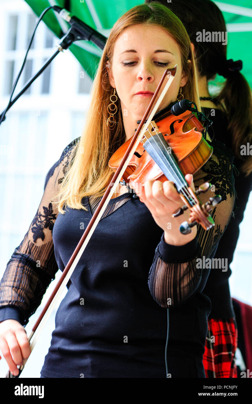 Folk musician plays playing violin performing hires stock photography