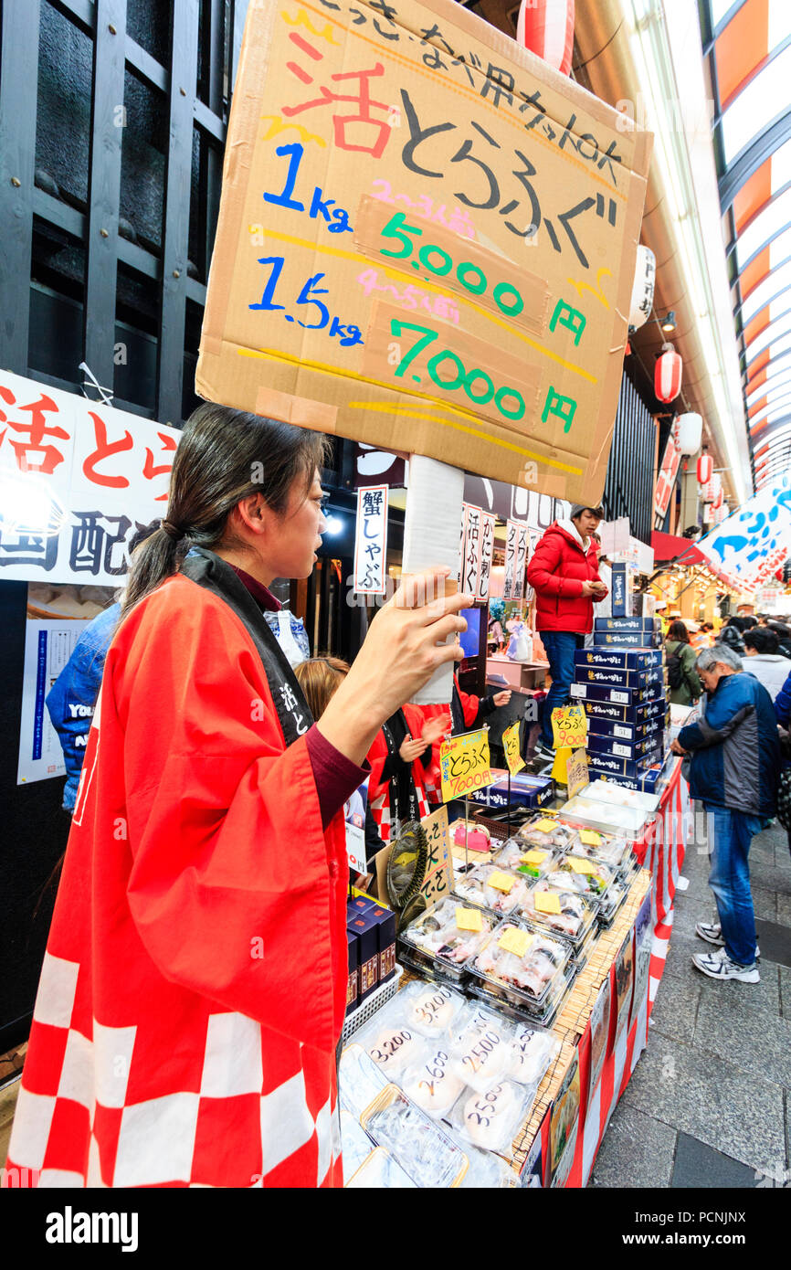 Kuromon Ichiba Food Market In Osaka Fish Mongers Stall With