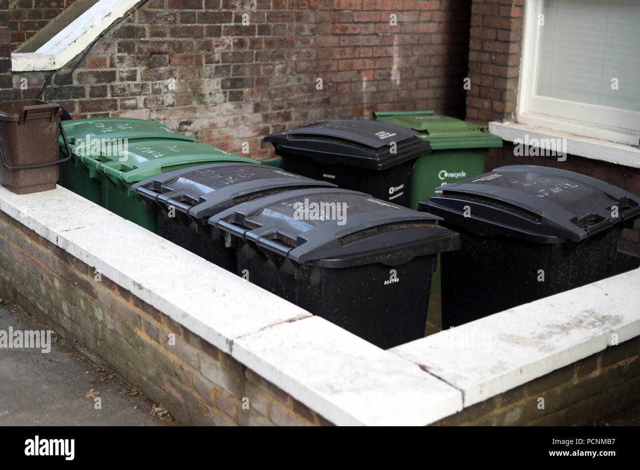Multiple wheelie bins hi-res stock photography and images - Alamy