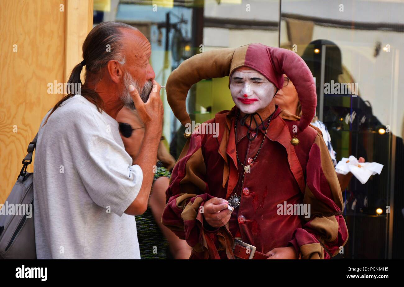 The jester in Prague street Stock Photo