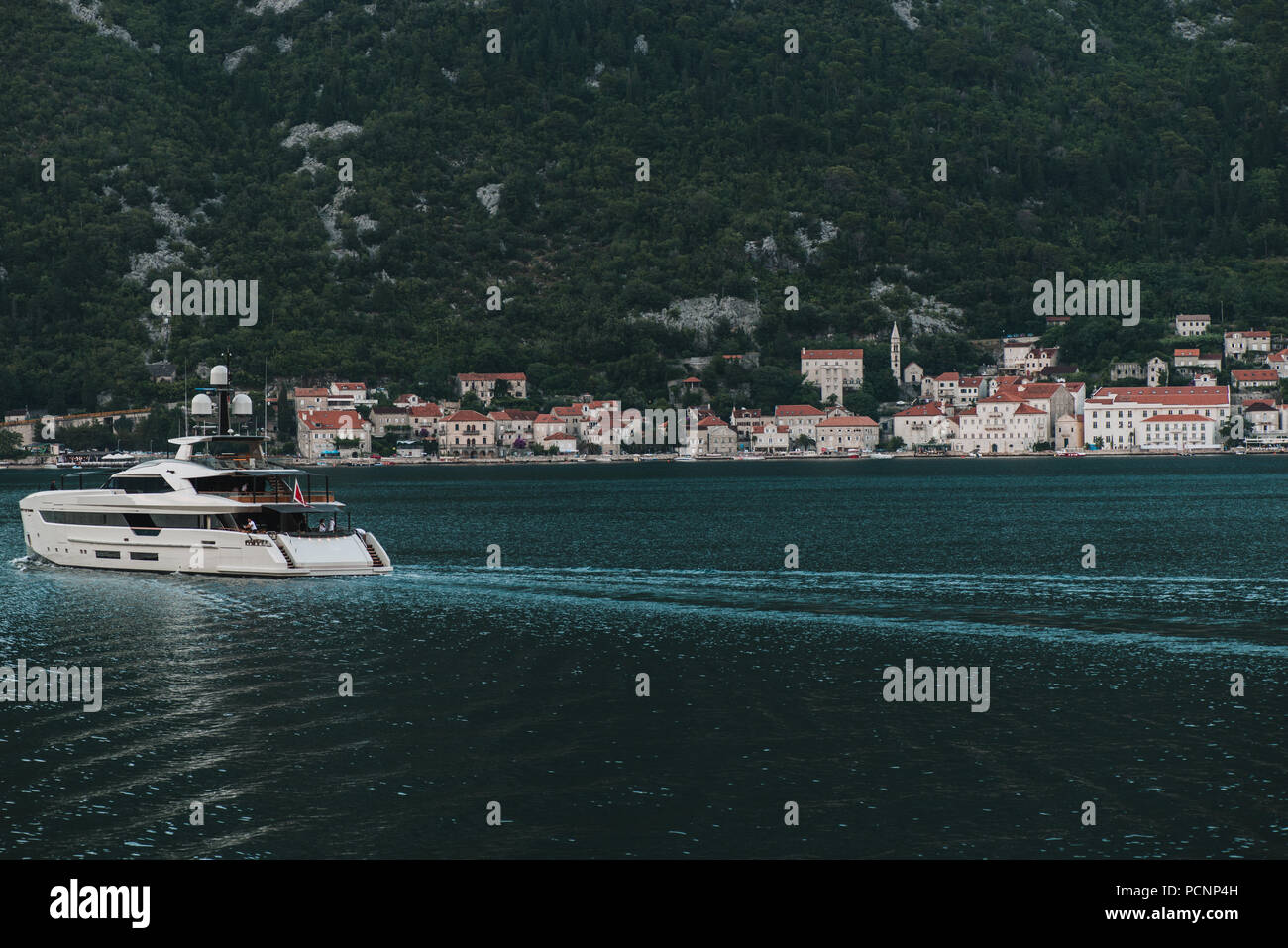 Expensive big yacht sails in the Kotor bay. Stock Photo