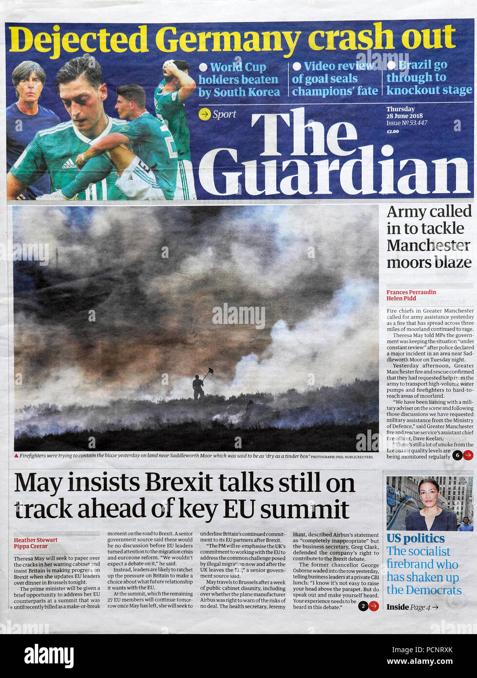 'Dejected Germany crash out' of World Cup 2018 and 'May insists Brexit still on track ahead of key EU Summit' Guardian Newspaper headline June 2018 UK Stock Photo