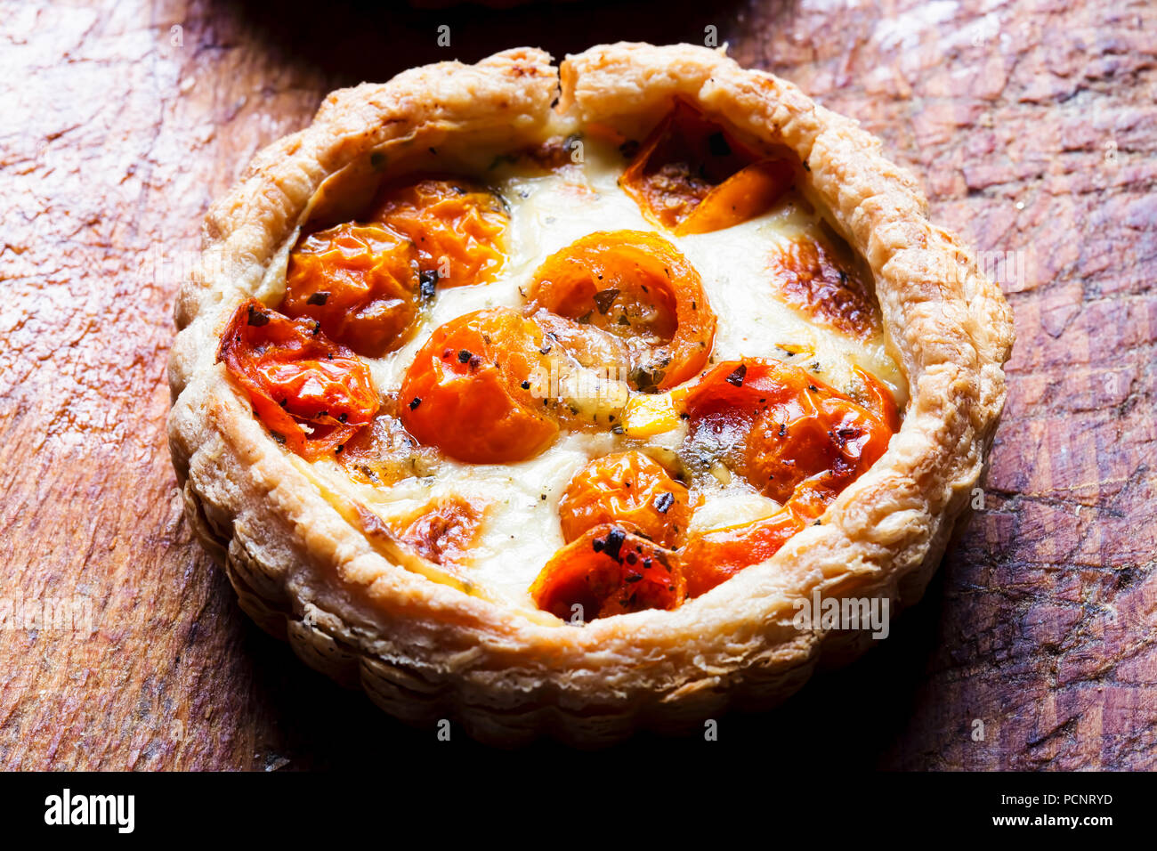 Tomato & camembert tart. Puff pastry filled with camembert cheese
