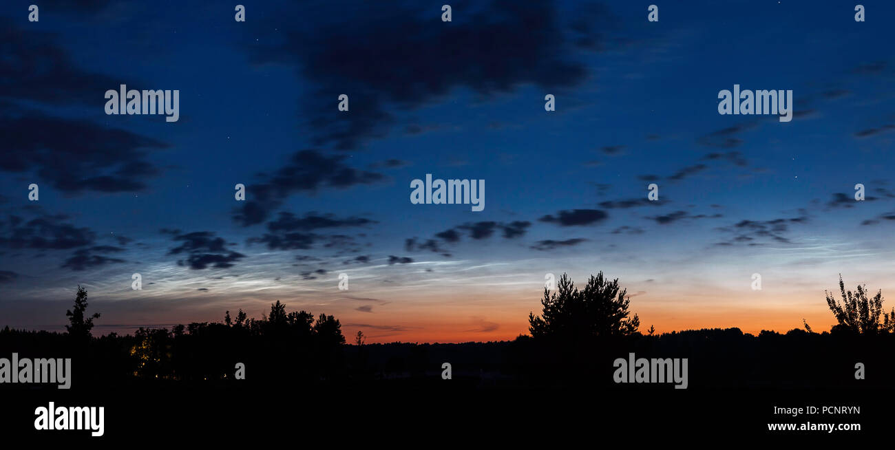 Night landscape panorama with Noctilucent clouds in Lithuania Stock Photo