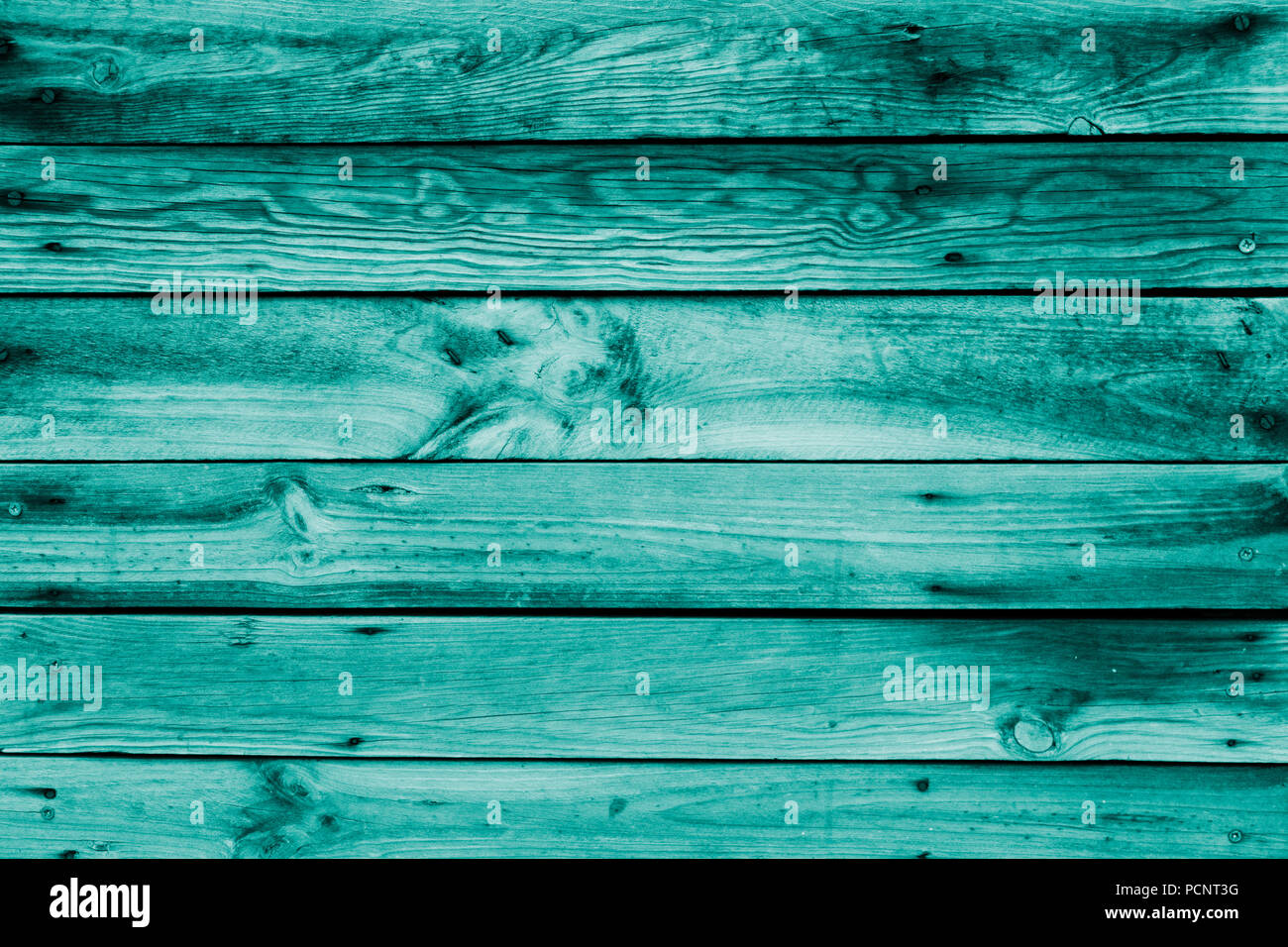 Close-up of the surface (wall, floor or overhead) made of wooden plank, panel or board in the turquoise, teal blue shade Stock Photo