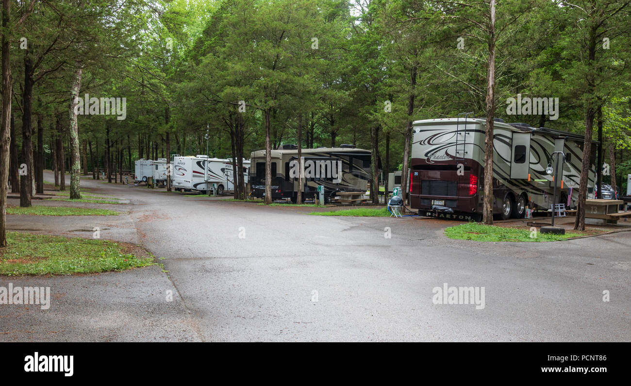 LEBANON, TN, USA-28 JUNE 18:  A line of class A RVs, in Cedars of Lebanon State Park campground, on a rainy day. Stock Photo