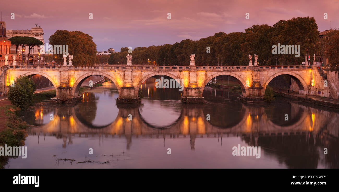 Angel Bridge reflected in the Tiber at sunset,Rome,Lazio,Italy Stock Photo