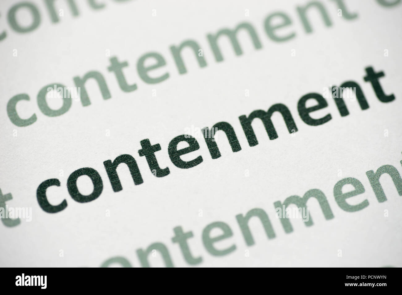 word contenment printed on white paper macro Stock Photo