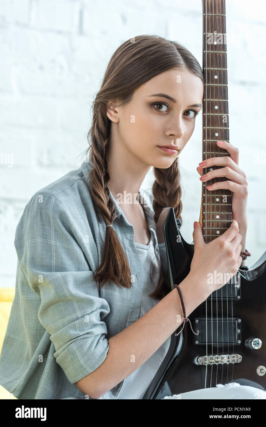 Beautiful young girl posing with guitar stock photo containing guitar and |  People Images ~ Creative Market