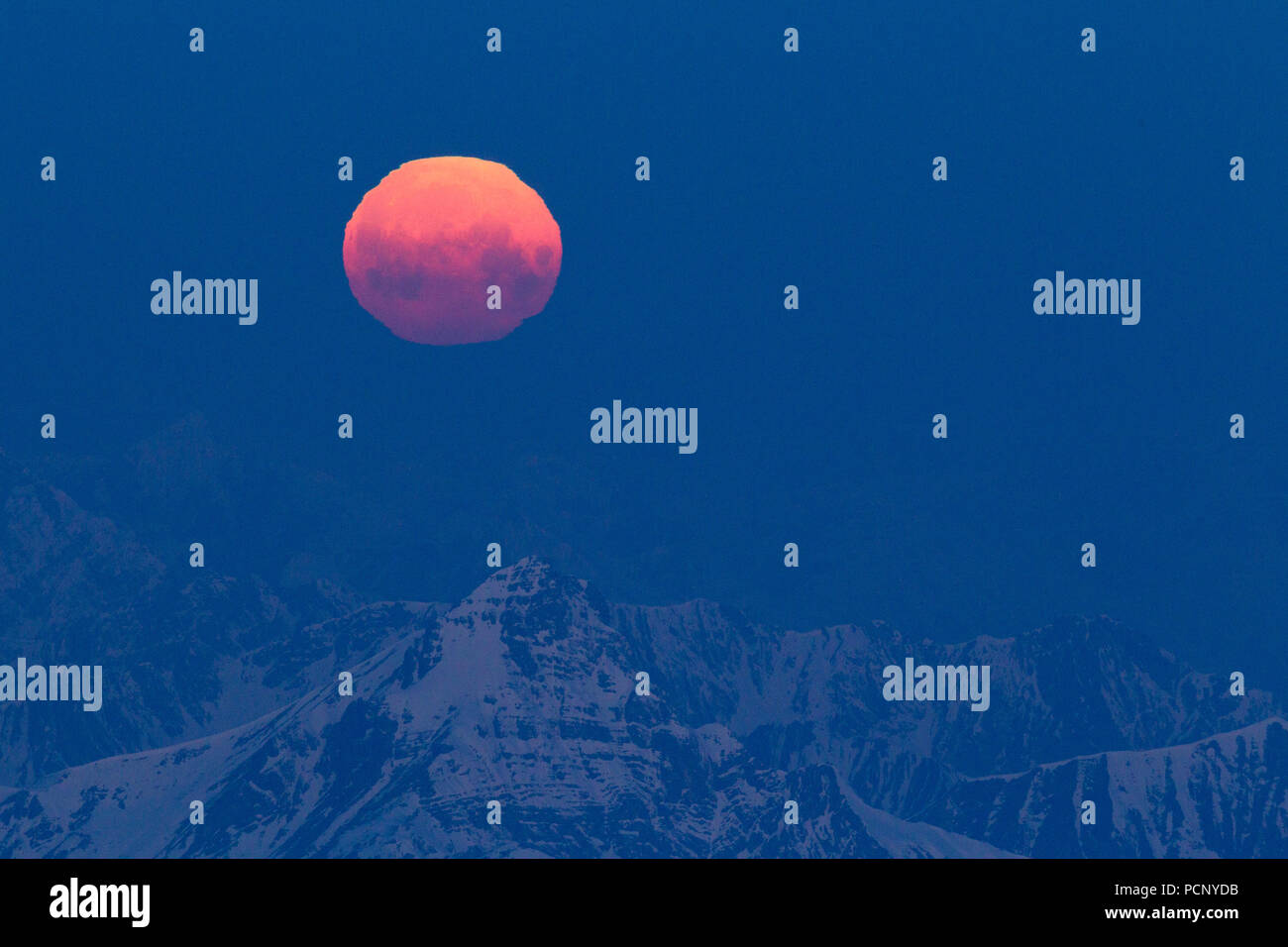 Moonrise at summit of Zugspitze, Wetterstein Mountains, close Garmisch, Upper Bavaria, Bavaria, Germany Stock Photo