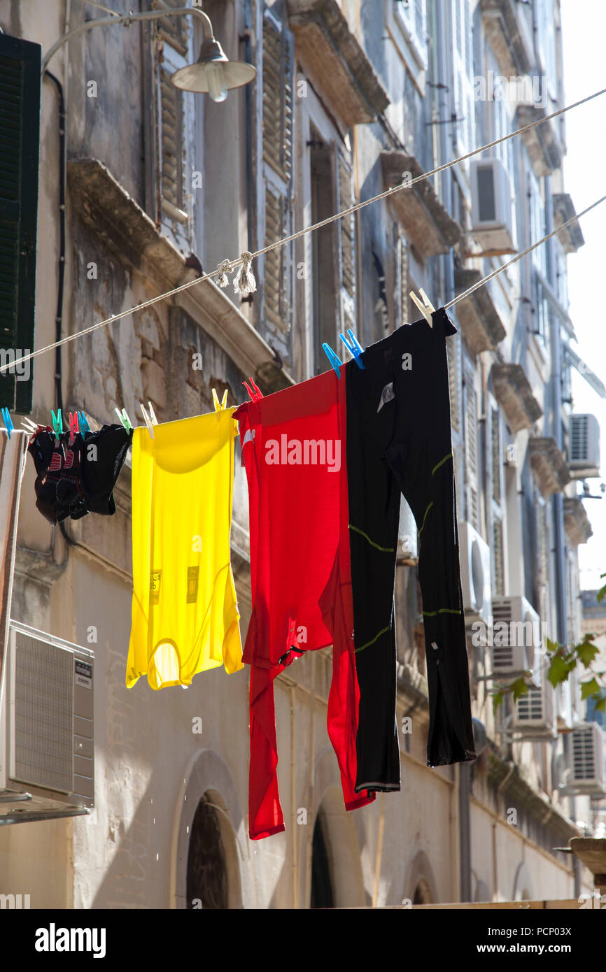 Greece, Corfu, laundry in German national colours on clothes line Stock Photo