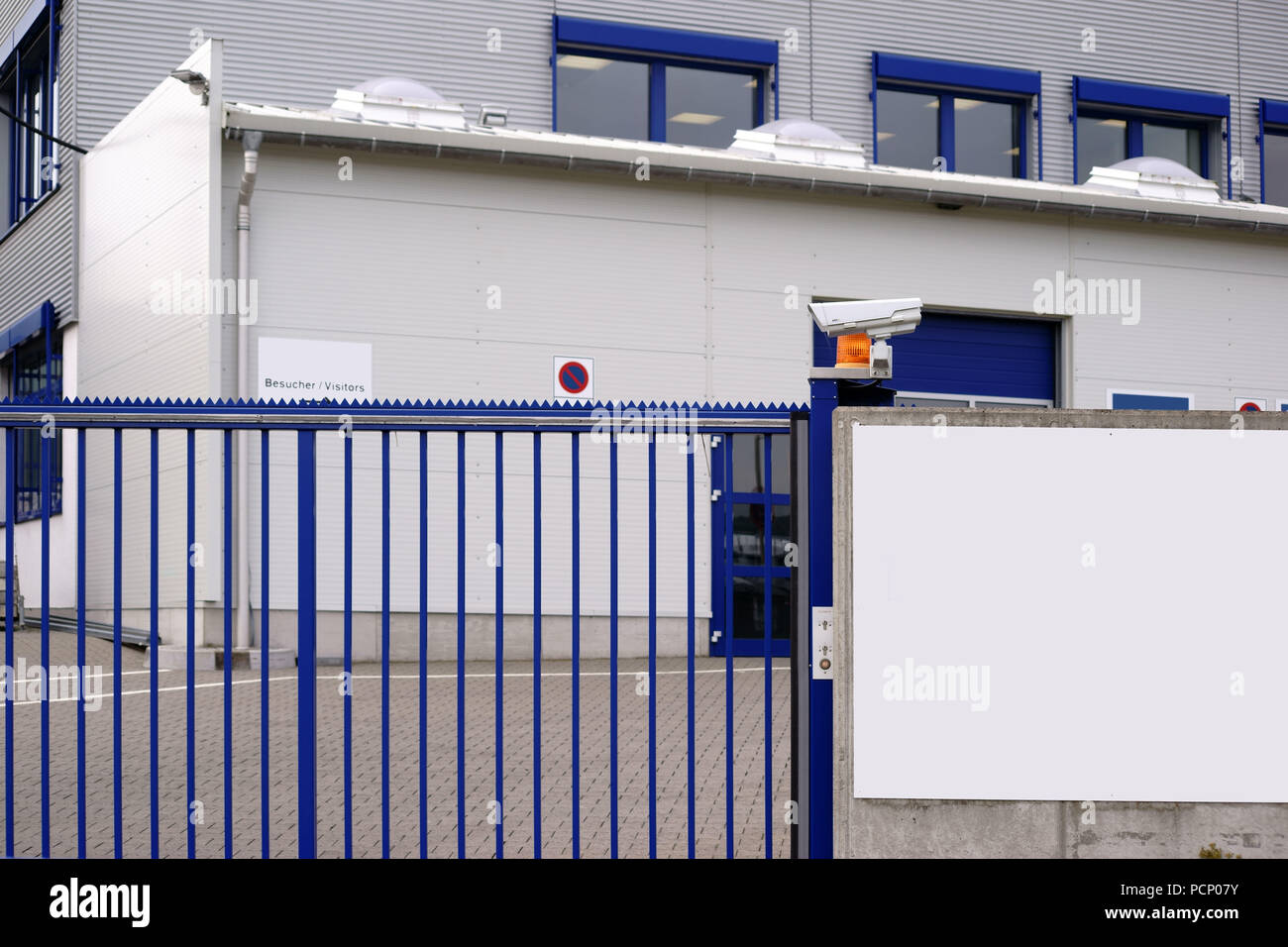 The camera-monitored entrance gate of a factory entrance to a factory and industrial site. Stock Photo