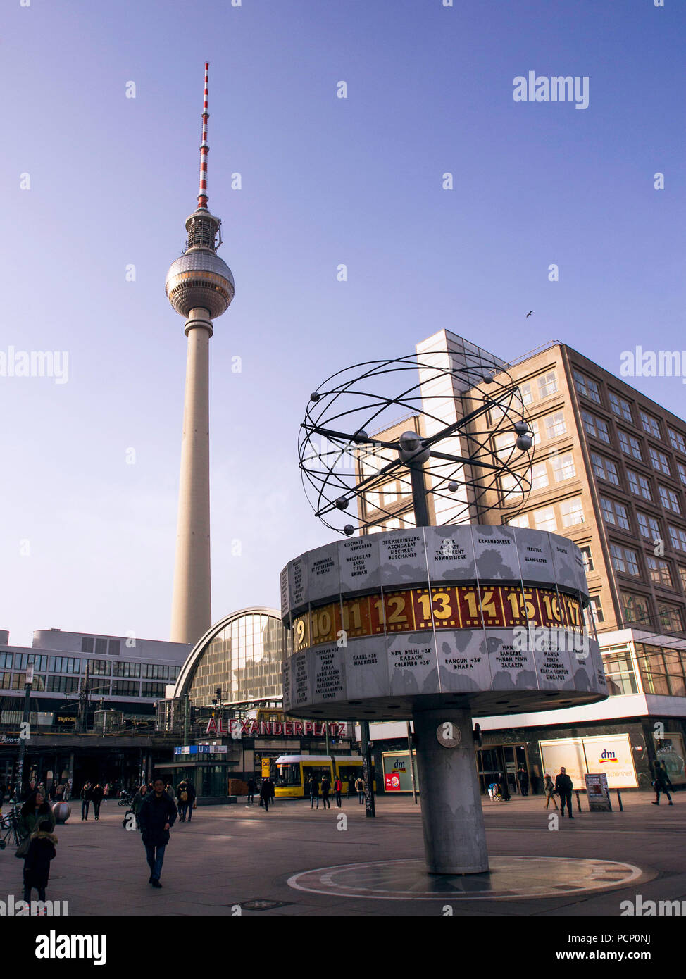 Berlin Alexanderplatz with world time clock, TV tower and train station Stock Photo