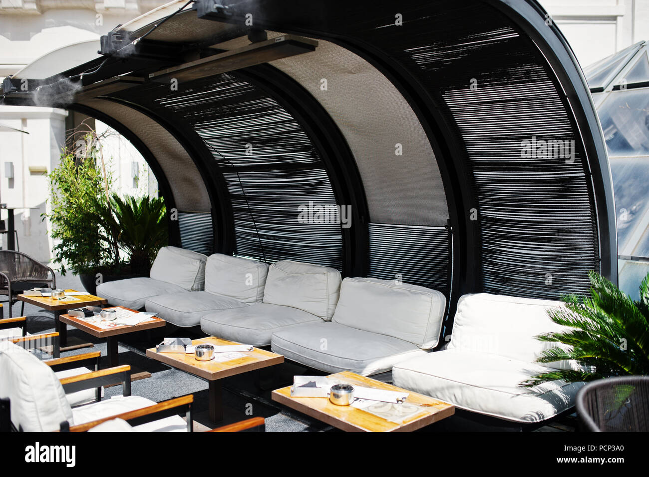 Smoking area outdoor with tables and chairs Stock Photo Alamy