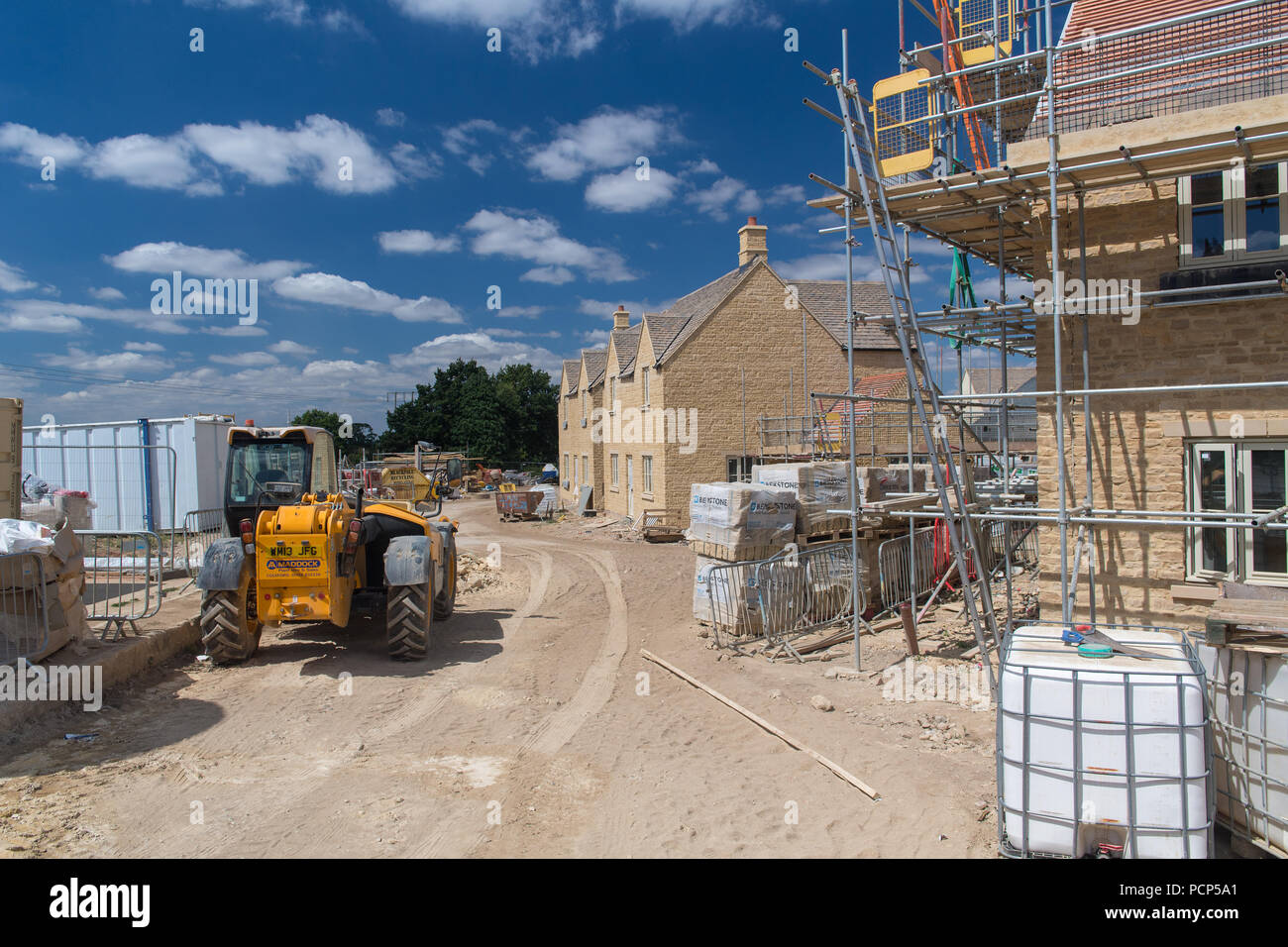 Houses being built on a green field site near Broadway in the Cotswolds, UK. Stock Photo
