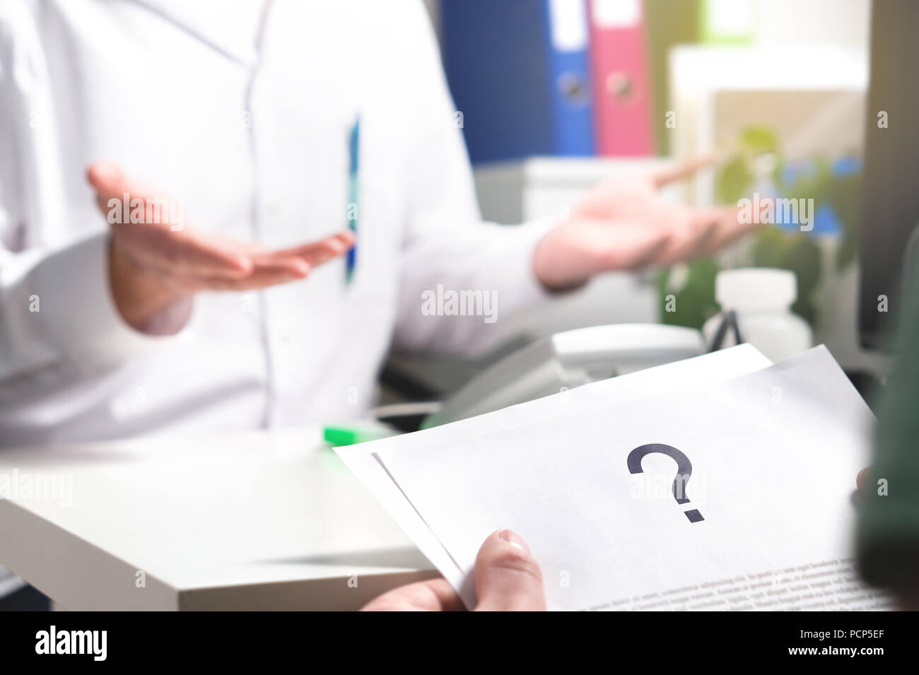 Medical problem. Patient reading health care document with question mark. New or unknown disease. Can't find or no cure for illness. Wrong diagnosis.  Stock Photo