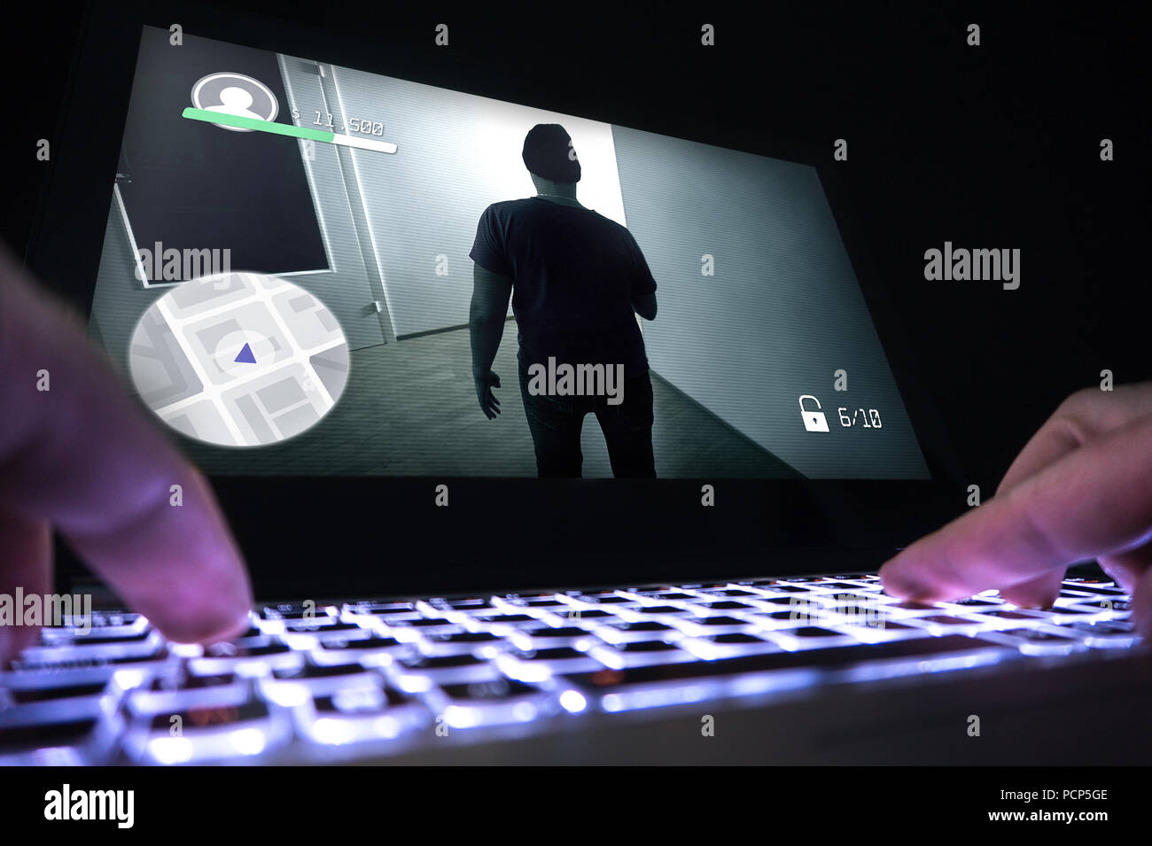 Playing video game with laptop. Computer and online gaming concept. Competitive gaming, electronic sports and esports. Stock Photo