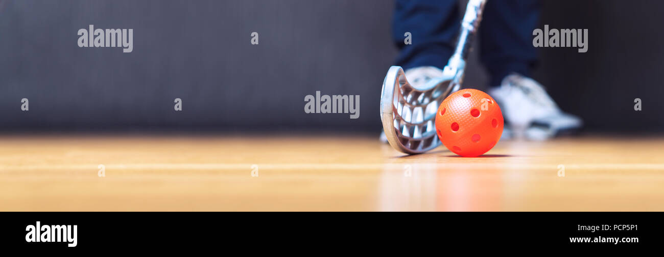 Floorball banner, background and template with ball, stick and player. Floor hockey concept. Negative copy space. Stock Photo