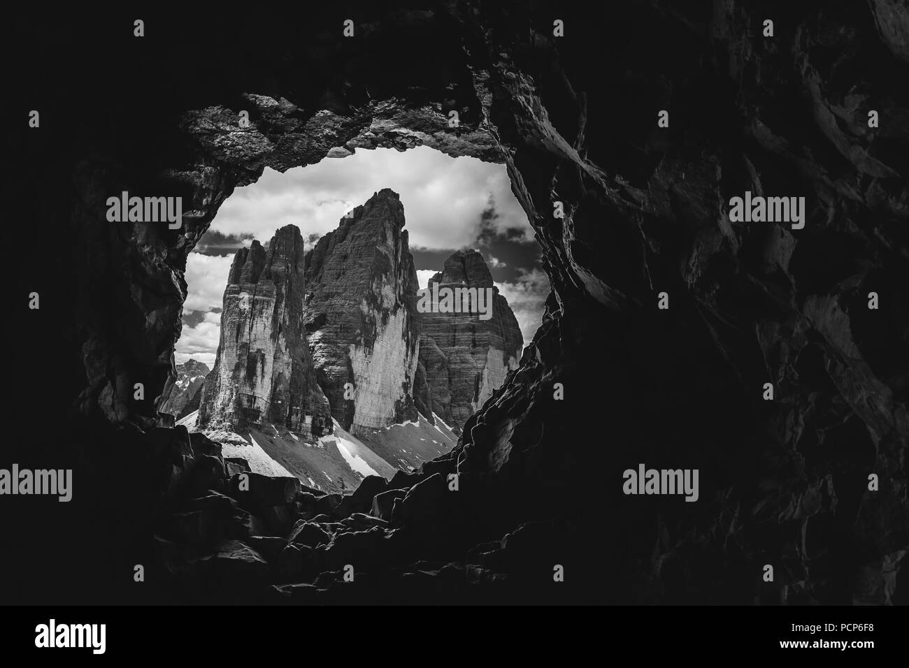 Tre Cime di Lavaredo Peaks black and white effect from a cave post of the First World War, Mount Paterno, Dolomites, Italy Stock Photo