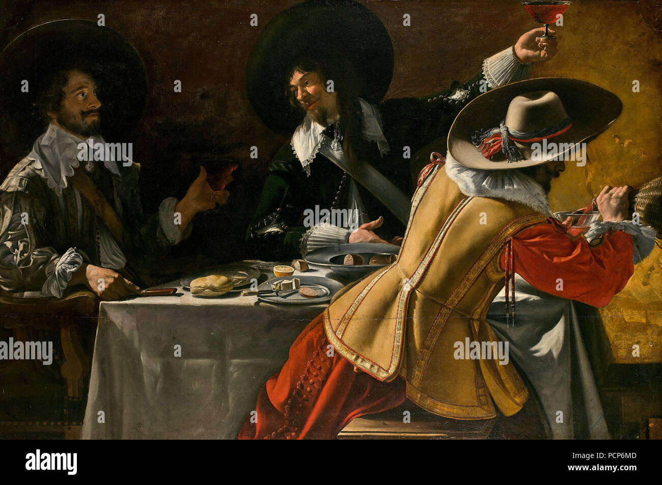 The Three Musketeers sitting at a table, c.1630. Stock Photo