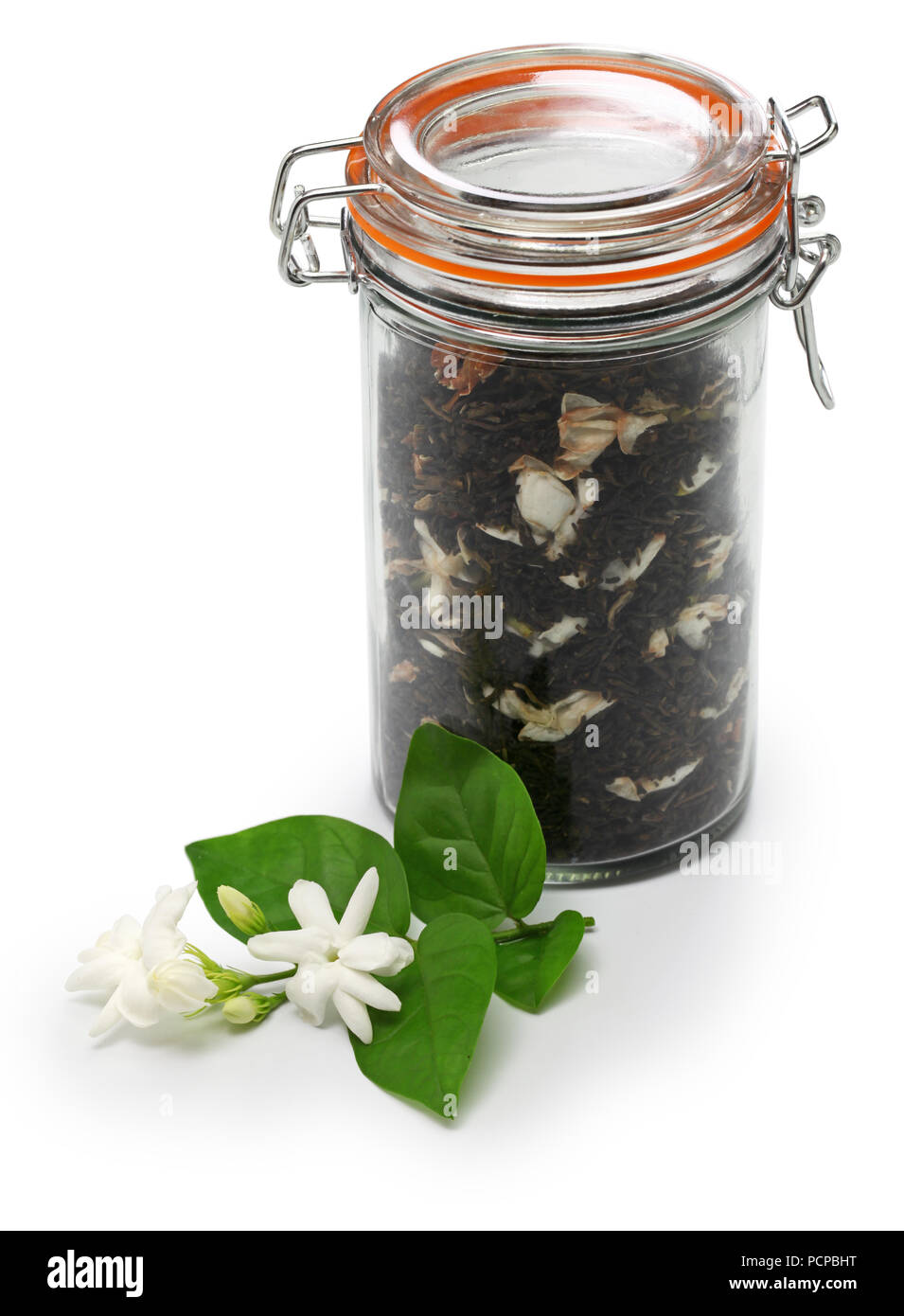 making jasmine tea, green tea with arabian jasmine flower in glass jar