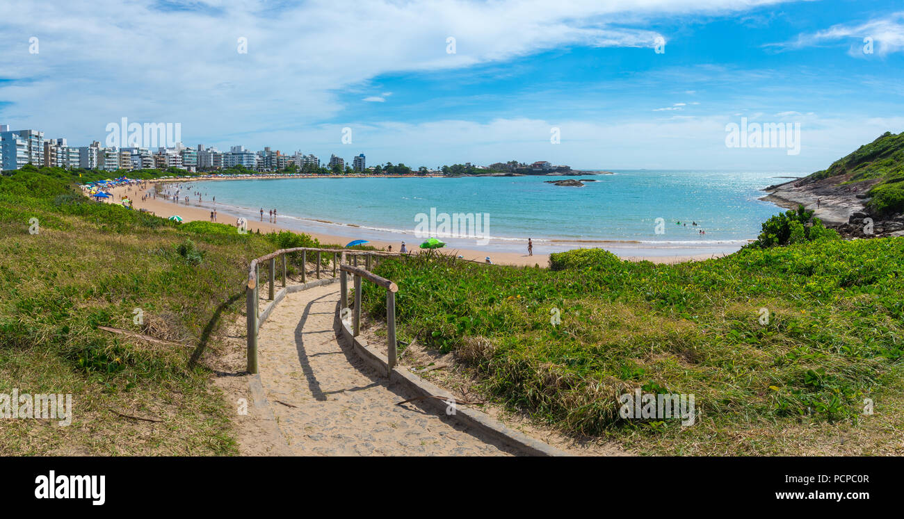 GUARAPARI, ES, BRAZIL - DECEMBER 31, 2017: Panoramic view of Peracanga Beach crowded by tourists enjoying the beach before New Year's eve parties. Stock Photo