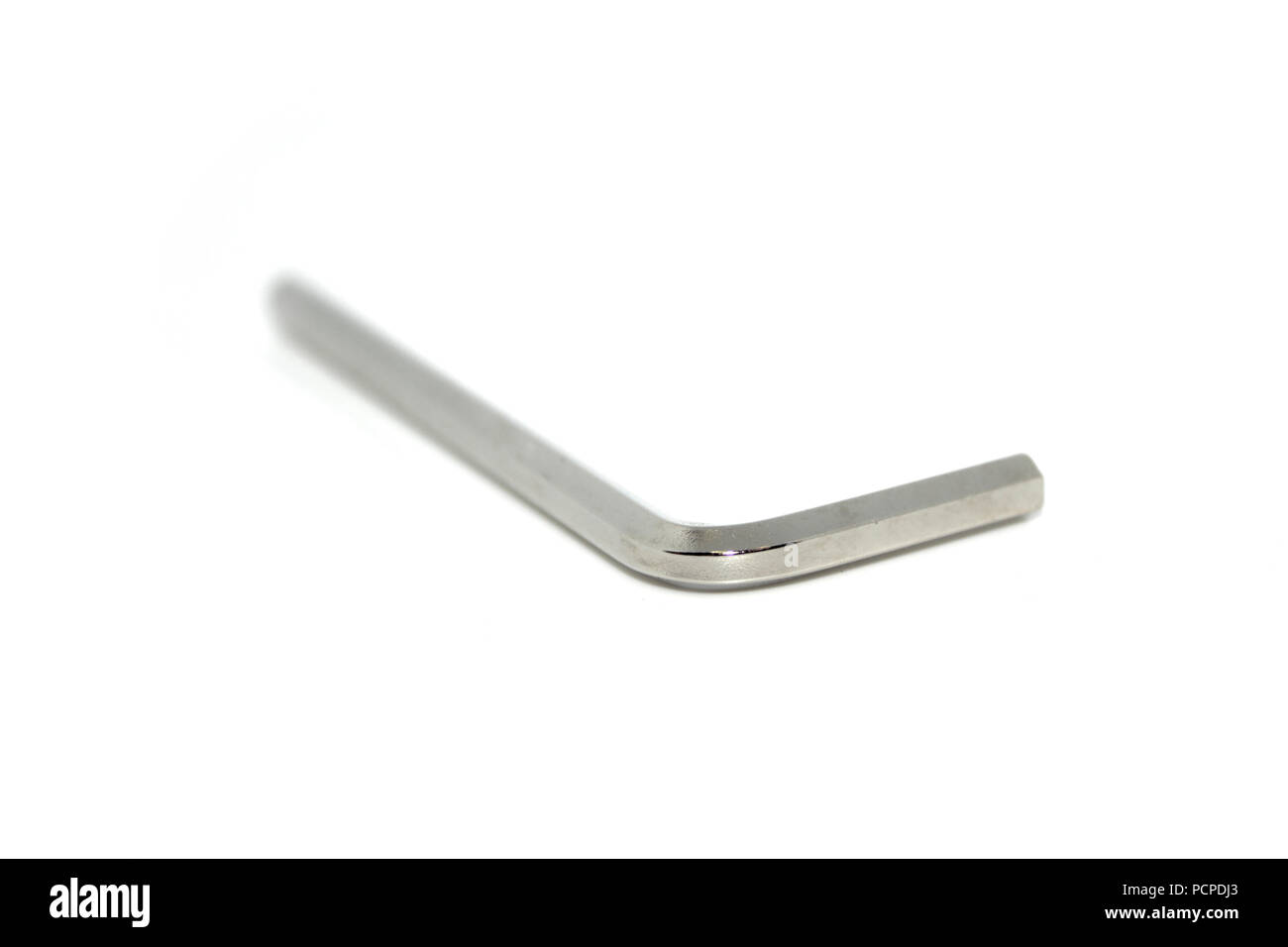 Single isolated Allen screw driver wrench made from stainless steel on white background Stock