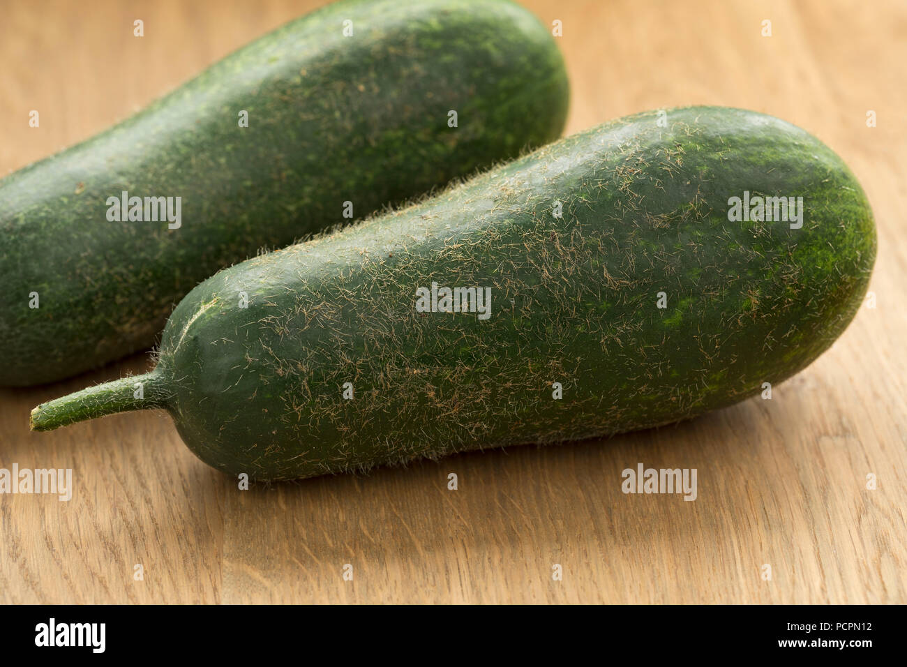 Pair of fresh raw fuzzy melon close up Stock Photo