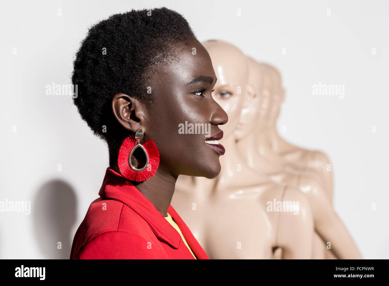 side view of beautiful smiling african american girl looking away and